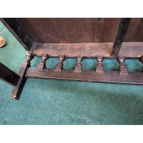 283 - AN ANTIQUE OAK VICTORIAN CARVED BENCH, IN THE JACOBEAN REVIVAL STYLE, HIGH PANELLED BACK WITH HEAVIL... 