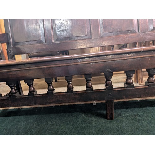 283 - AN ANTIQUE OAK VICTORIAN CARVED BENCH, IN THE JACOBEAN REVIVAL STYLE, HIGH PANELLED BACK WITH HEAVIL... 
