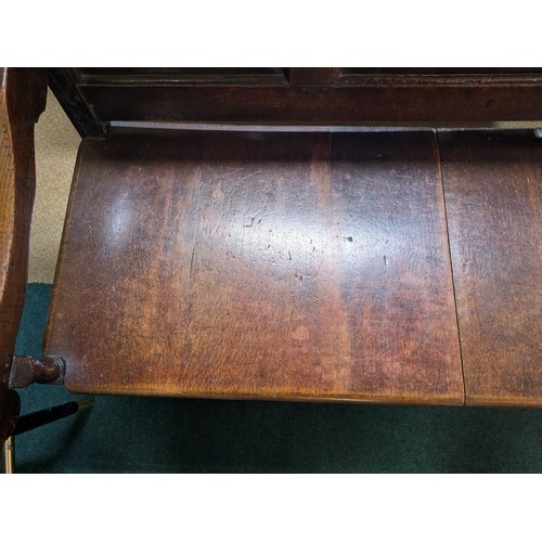 283 - AN ANTIQUE OAK VICTORIAN CARVED BENCH, IN THE JACOBEAN REVIVAL STYLE, HIGH PANELLED BACK WITH HEAVIL... 