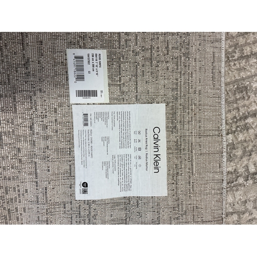 40 - CALVIN KLEIN ‘RADIUS’ SILVER GREY AREA RUG 238cm x 299cm