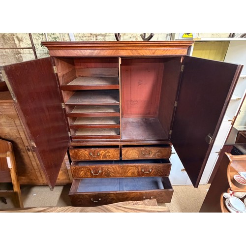 238 - A GEORGIAN MAHOGANY LINEN PRESS, A MOULDED CORNICE OVER TWO PANELLED DOORS OPENING TO SHELVED AND DR... 