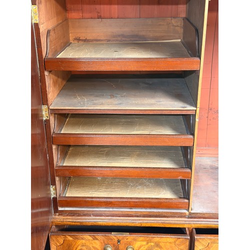 238 - A GEORGIAN MAHOGANY LINEN PRESS, A MOULDED CORNICE OVER TWO PANELLED DOORS OPENING TO SHELVED AND DR... 