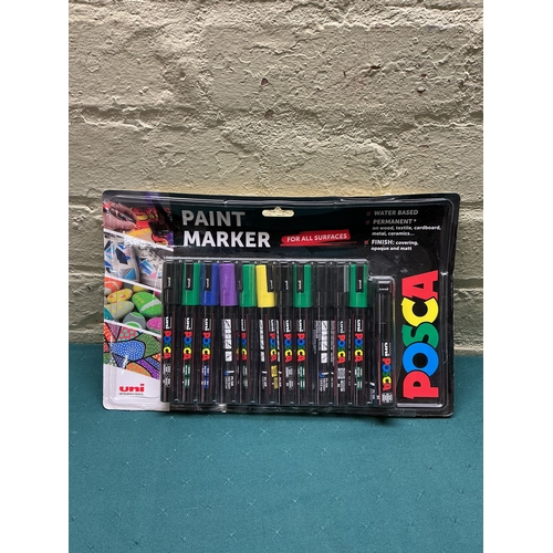 32 - A PACKAGED 12 PACK OF POSCA PAINT PENS