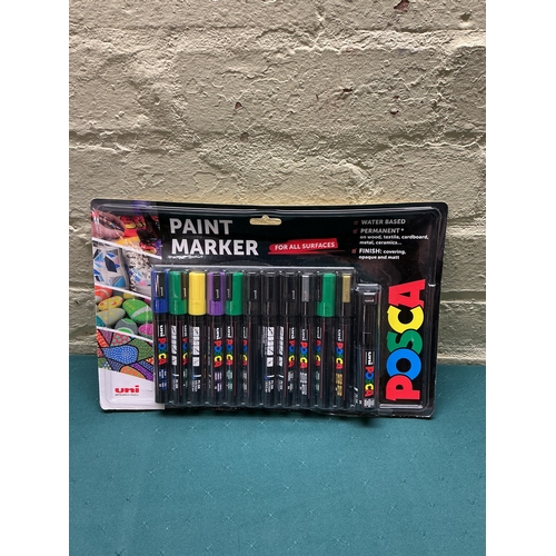 33 - A PACKAGED 12 PACK OF POSCA PAINT PENS