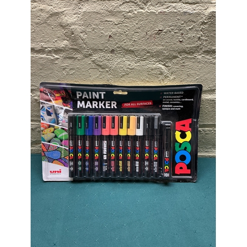 34 - A PACKAGED 12 PACK OF POSCA PAINT PENS