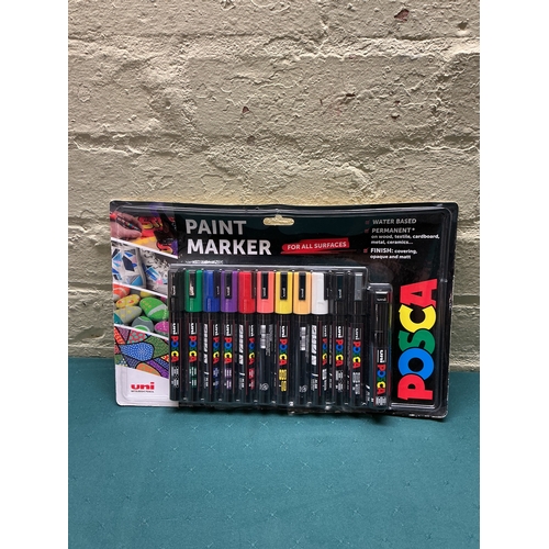 36 - A PACKAGED 12 PACK OF POSCA PAINT PENS