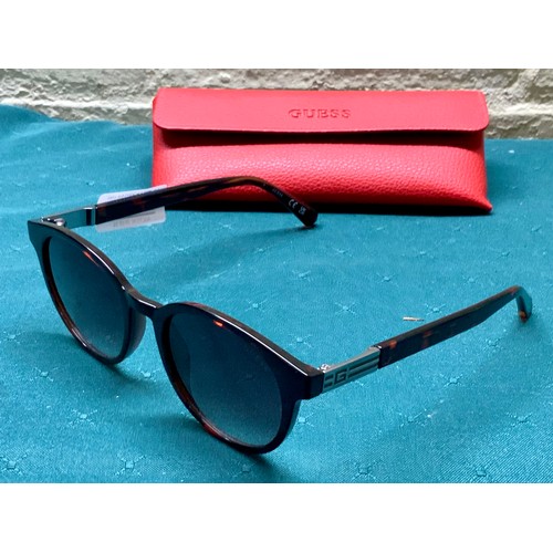 46 - PAIR OF GUESS SUNGLASSES IN TORTOISE SHELL EFFECT WITH RED GUESS CASE - GU00040
