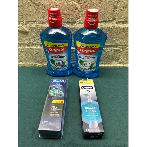 31 - A QTY OF ORAL B REPLACEMENT TOOTHBRUSH HEADS IO AND PRO TOGETHER WITH 2X 1L COLGATE MOUTHWASH