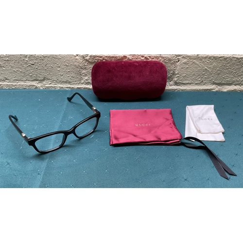 52 - PAIR OF GUCCI GG1025OZ SPECTACLE FRAMES WITH CARRY CASE AND POSHETTE