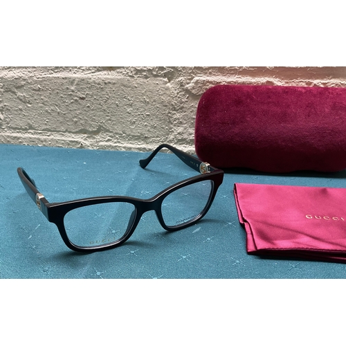 52 - PAIR OF GUCCI GG1025OZ SPECTACLE FRAMES WITH CARRY CASE AND POSHETTE