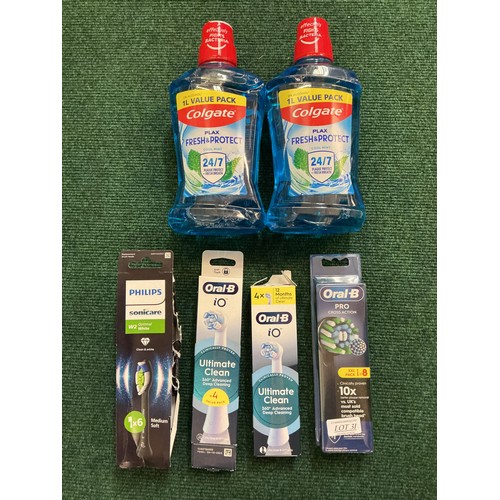 31 - A QTY OF ORAL B REPLACEMENT TOOTHBRUSH HEADS IO AND PRO TOGETHER WITH 2X 1L COLGATE MOUTHWASH