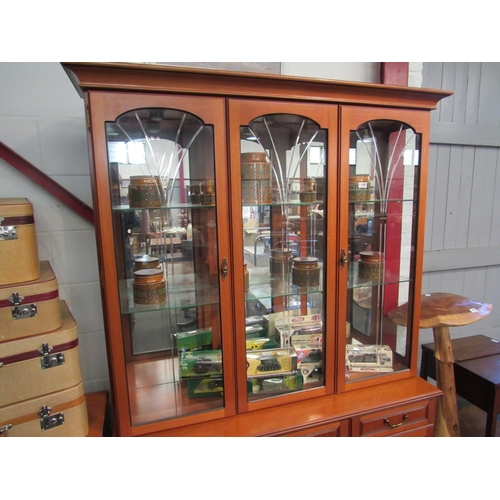 1002 - A modern Morris glazed cabinet on three drawer, three door base. 188cm x 130cm x 45cm