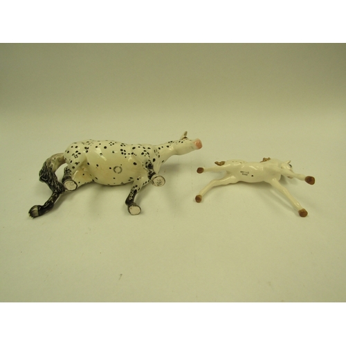 1441 - A Beswick Appaloosa- spotted walking pony in gloss, model no. 1516 together with a Wade foal