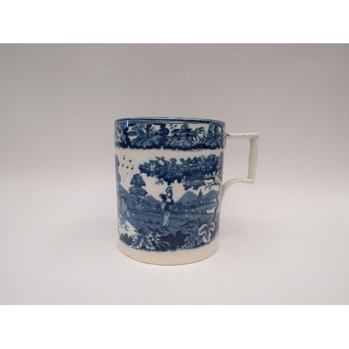 1442 - A large mug/tankard with blue and white transferware decoration, paper label to base 