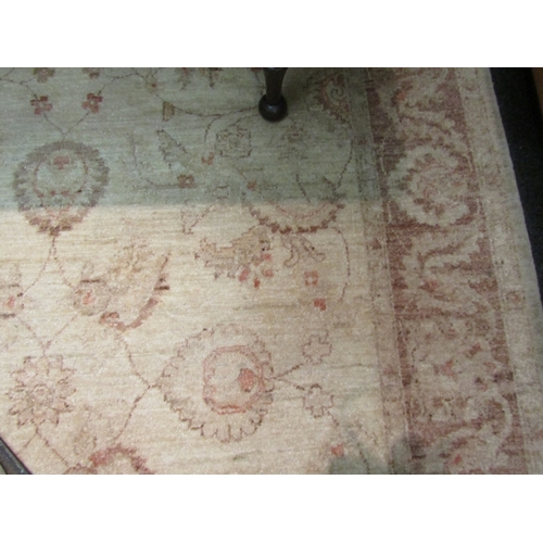 1652 - A wool cream carpet, beige foliate border and central pattern, 215cm x 155cm