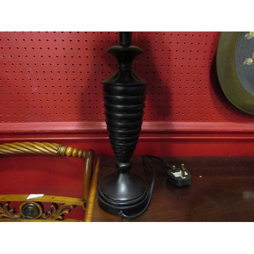 40 - An ebony table lamp with bobbin turned base and cream design shade, 55cm tall  (C)