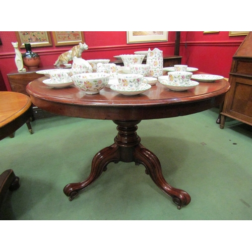 64 - Circa 1860 a mahogany circular top table on a turned column base and scroll foot tripod legs with ce... 