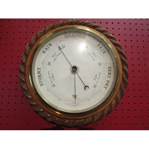 95 - WITHDRAWN: An early 20th Century oak cased wall mounted barometer with rope twist carving. Overall 2... 