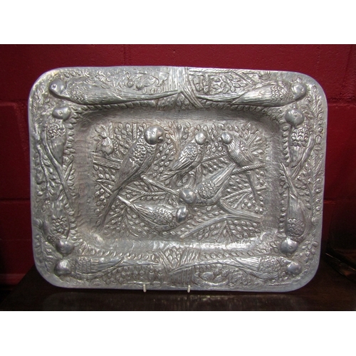 126 - A heavily embossed rounded rectangular tray depicting parakeets, 49cm long (R) £20