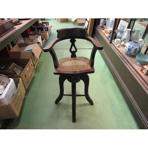 222 - A late Victorian child's high seat revolving height adjustable captain's chair with cane seat    (R)... 