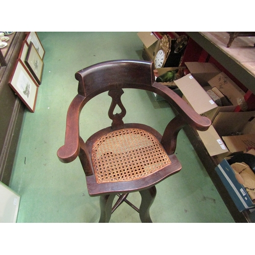 222 - A late Victorian child's high seat revolving height adjustable captain's chair with cane seat    (R)... 