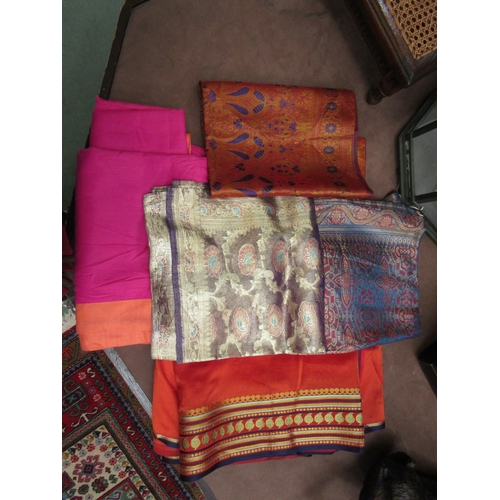 245 - Two Indian sari skirts and three silk squares; gold, orange and turquoise