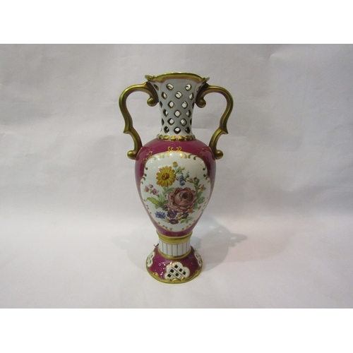 275 - A Royal Dux Czechoslovakian pierced porcelain vase decorated with floral sprays. 29cm tall