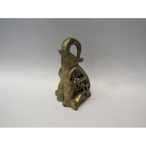 285 - A cast metal elephant figure with pierced body, 19cm tall     (E) £4-6