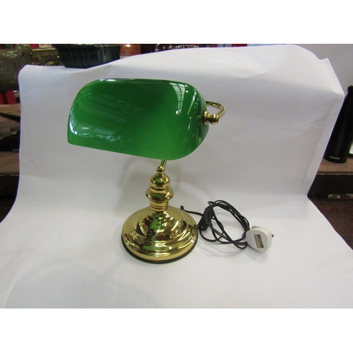 114 - A brass based bankers lamp with green glass shade