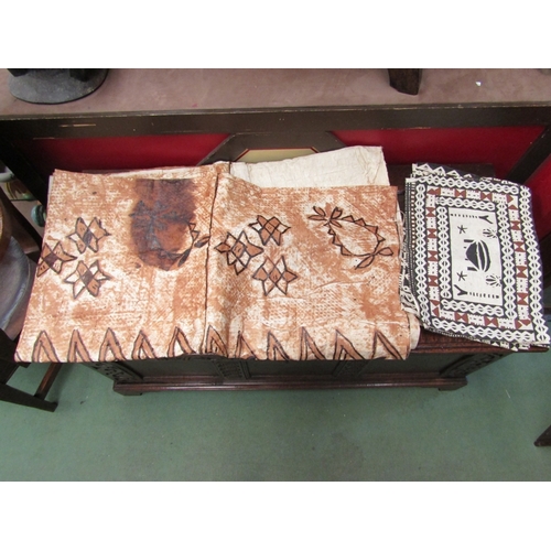 11 - A wooden Tanzanian stool together with Pacific handpainted table mats, cloth etc     (R) £40