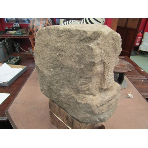 8 - A stone carved head reputedly Welsh Celtic from Buith Wells, on oak plinth base, 48cm tall including... 