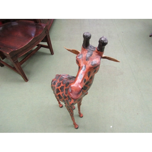 9 - A leather covered giraffe figure, 85cm tall      (E) £20-30