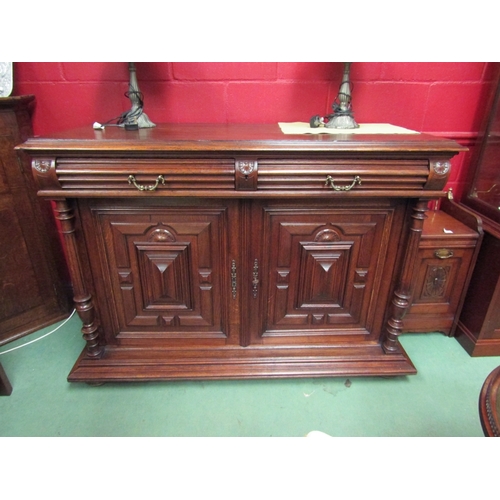 131 - A 19th Century French oak buffet sideboard the two frieze drawers over a two door cupboard with work... 