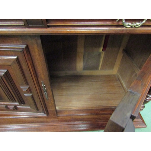 131 - A 19th Century French oak buffet sideboard the two frieze drawers over a two door cupboard with work... 