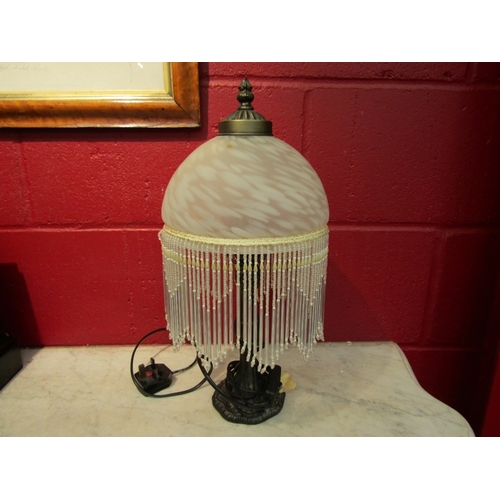 160 - A bedside lamp with glass tasselled bead shade