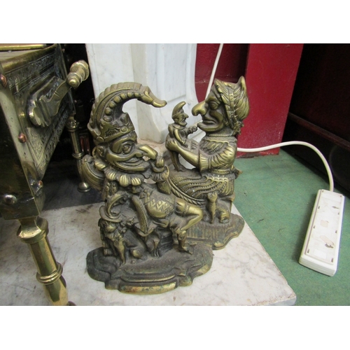 165 - Two Punch and Judy brass doorstops, 28cm and 27cm tall