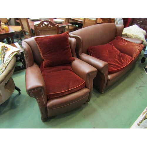 170 - A brown leatherette sofa with two armchairs