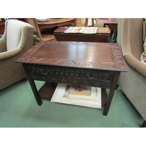 186 - An 18th Century and later oak lowboy the rectangular top with carved borders over a carved frieze an... 