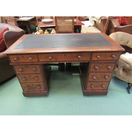 193 - A late Victorian oak twin pedestal desk of nine drawers over a plinth base on castors. 73cm x 115cm ... 