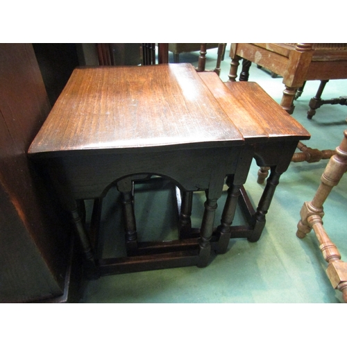 195 - An oak nest of 17th Century style three graduating occasional tables on turned legs joined by stretc... 