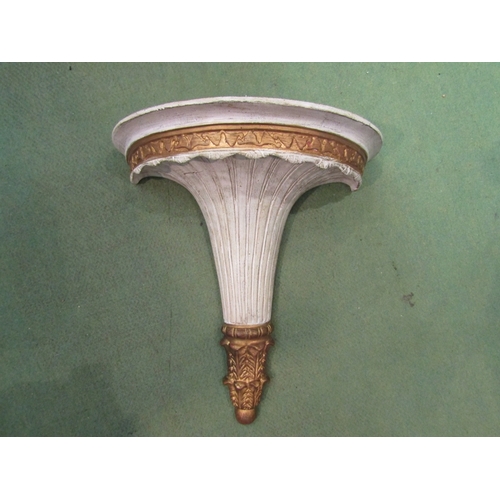 230 - A modern composite gilt and white painted wall bracket. 36cm length