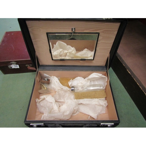 248 - A leather vanity case containing glass vanity set, with monogrammed original cover, together with a ... 