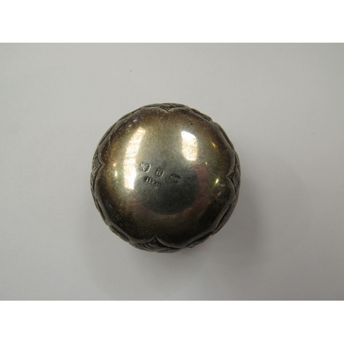 367 - A silver pill box and a white metal dressing table pot inscribed with a crest to front and with 