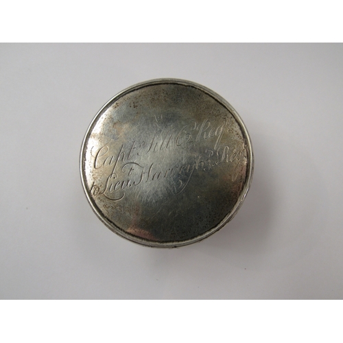 367 - A silver pill box and a white metal dressing table pot inscribed with a crest to front and with 