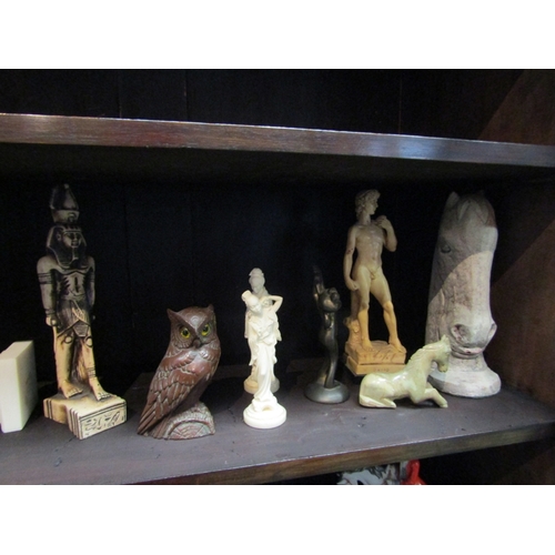 98 - Decorative figures including horse head, classical semi-clad, frog and Egyptian etc. (9)