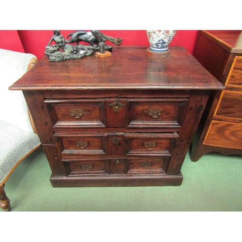 63 - Circa 1700 an oak two section country cottage chest of three drawers the planked top and panelled si... 