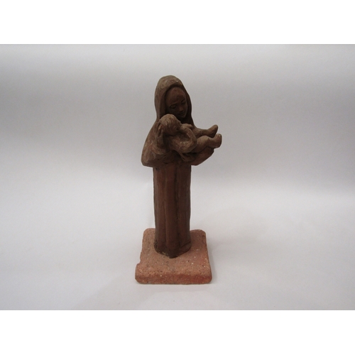 293 - A terracotta figure of Mother and Child, indistinctly signed at base on plinth, 28cm tall