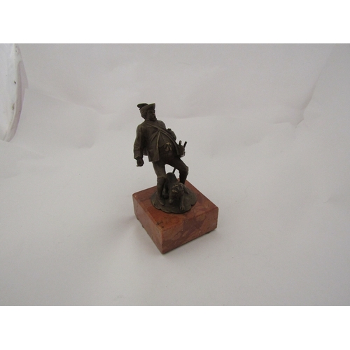 343 - A late Victorian Austrian bronze figure of a portly gamekeeper and his dog on a rose marble base, 11... 