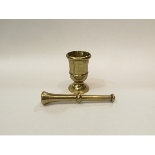 298 - A brass pestle and mortar