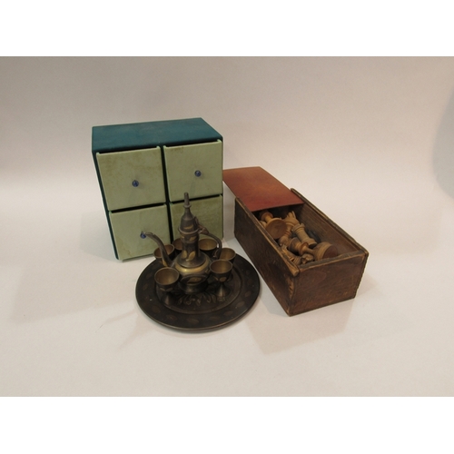 300 - A Turkish miniature coffee set on tray, bank of four drawers and a box containing wooden chess piece... 